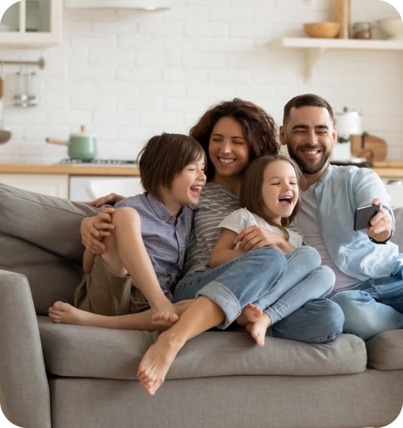 family together on the sofa