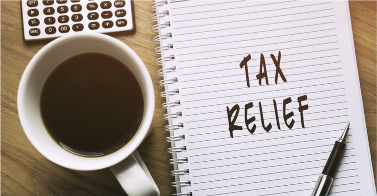 Tax relief written on notebook