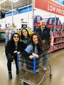 Four team members shopping for Angel Tree gifts