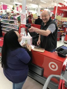 Happy Holidays from Our Home Tax Solutions Family to Yours 8 Sam Feldman and Amanda Mata ringing up angel tree purchases